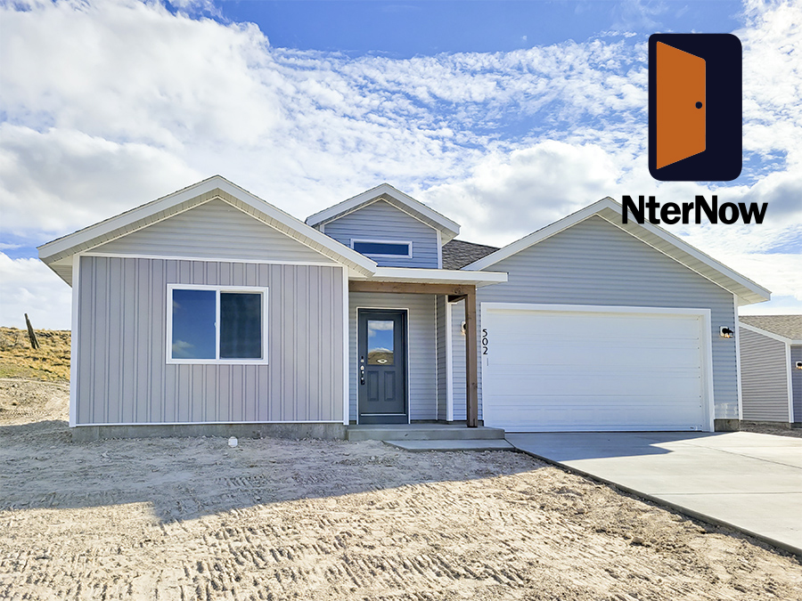 Exterior Photo of the Charming craftsman style single-story home by Smart Dwellings for sale on 502 Rodeo Ct in Rawlins WY Grey with White trim and 2-car garage